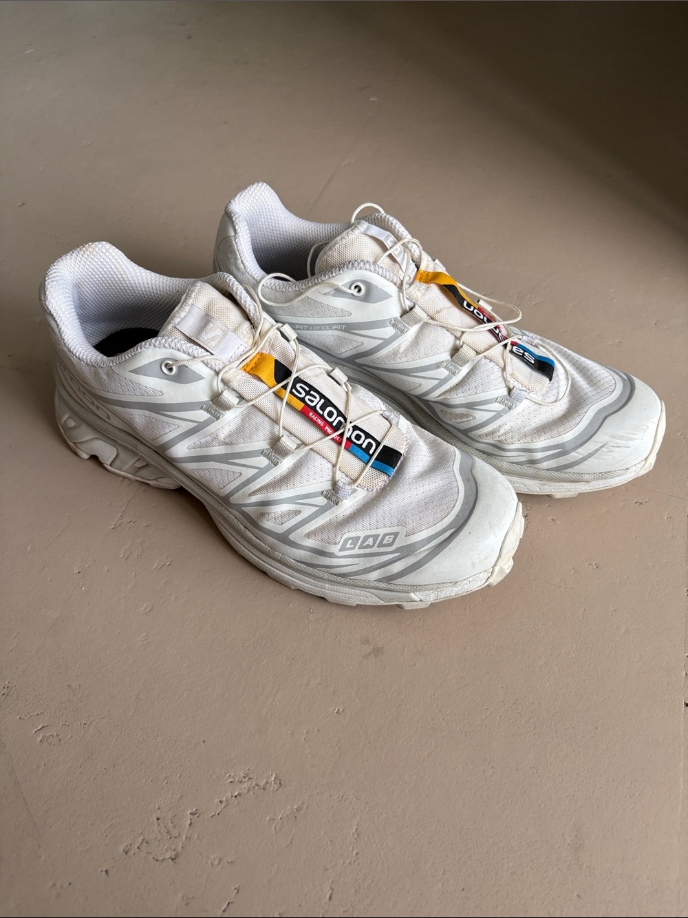 Salomon White Trail Running Shoes with Subtle Multicolor Tabs